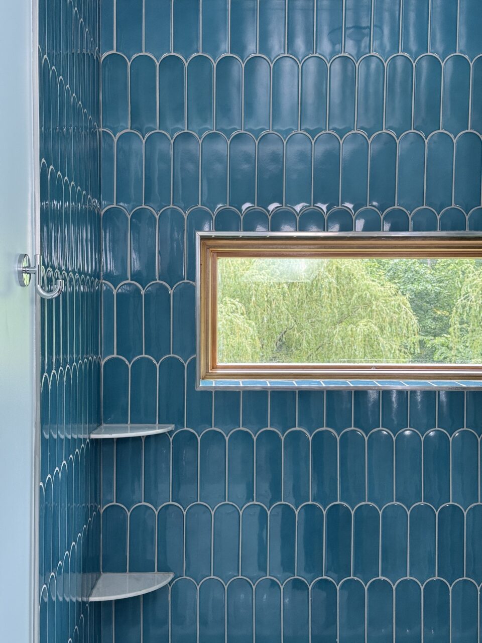 Shower With Blue Tile And Horizontal Window