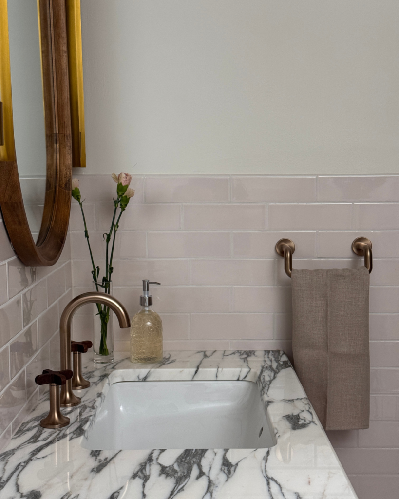 Arabescatto marble countertop, teak, faucet handles and ceramic tile